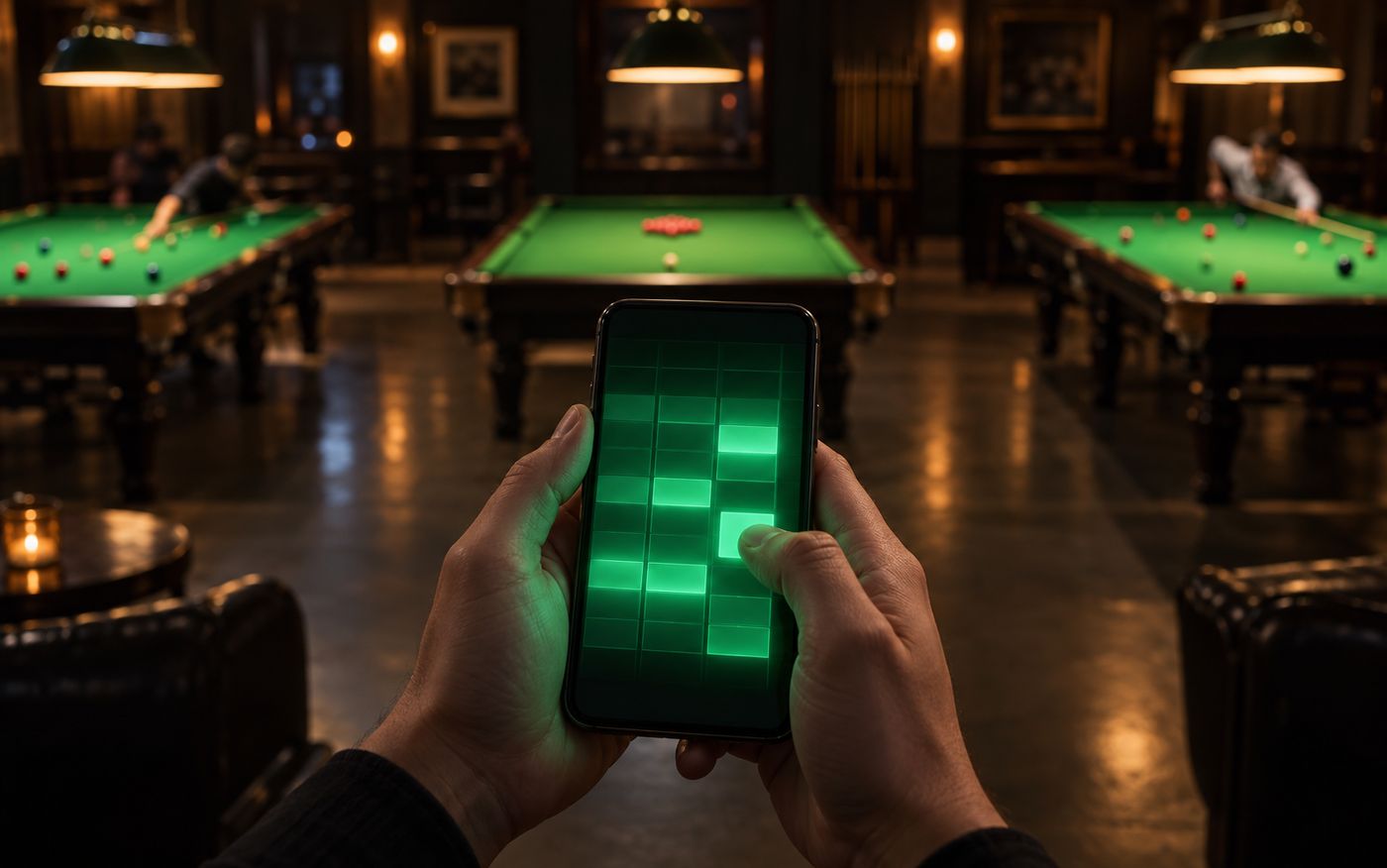 A table being booked from a phone while the hall fills up behind