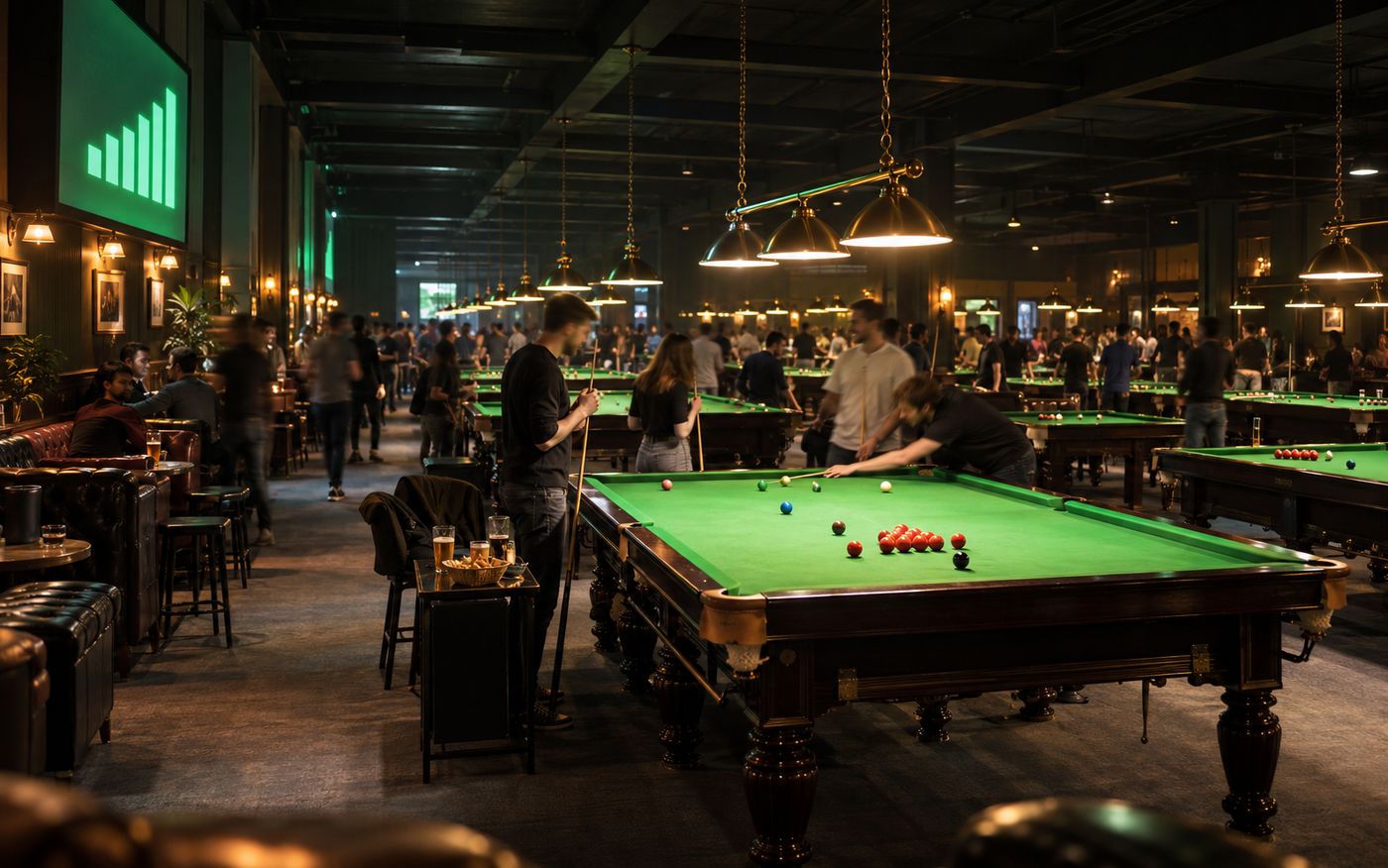 A snooker club at full capacity on a promotion night, every table lit and in play