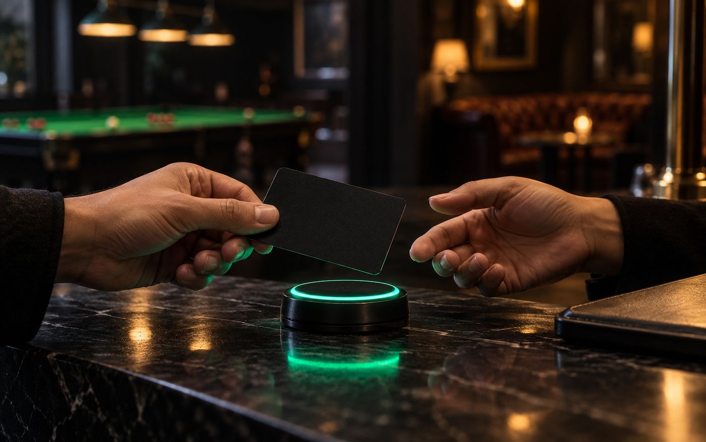 A membership card presented over an RFID reader at a snooker club counter