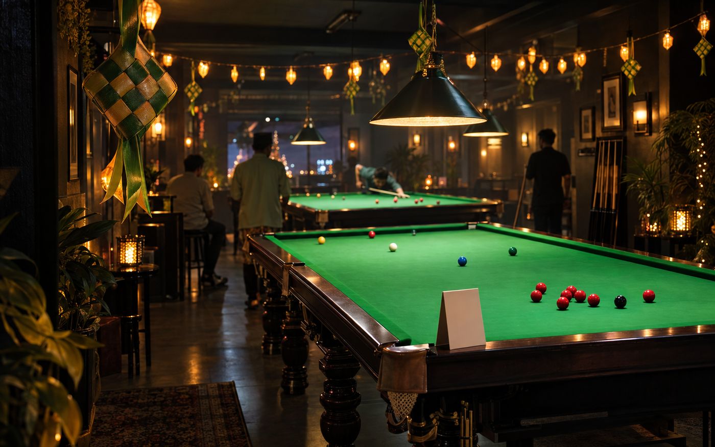 Snooker hall decorated for Hari Raya, festive lamps above tables lit for play