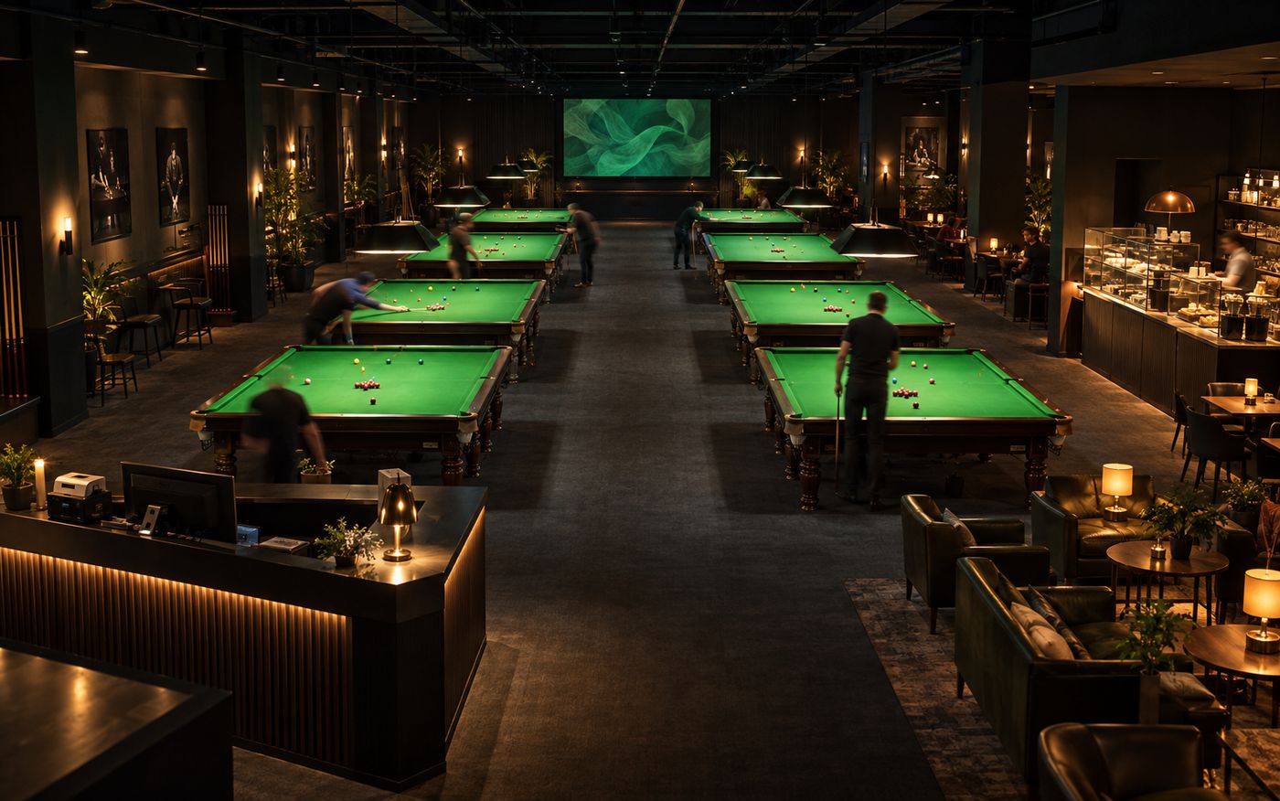 A whole snooker venue in one frame: the counter, two rows of tables, the food and beverage pass and the lounge, all running as one operation